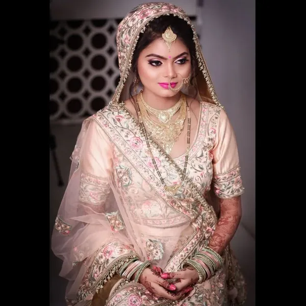 Bride in a cream and gold veil with a natural glowing base