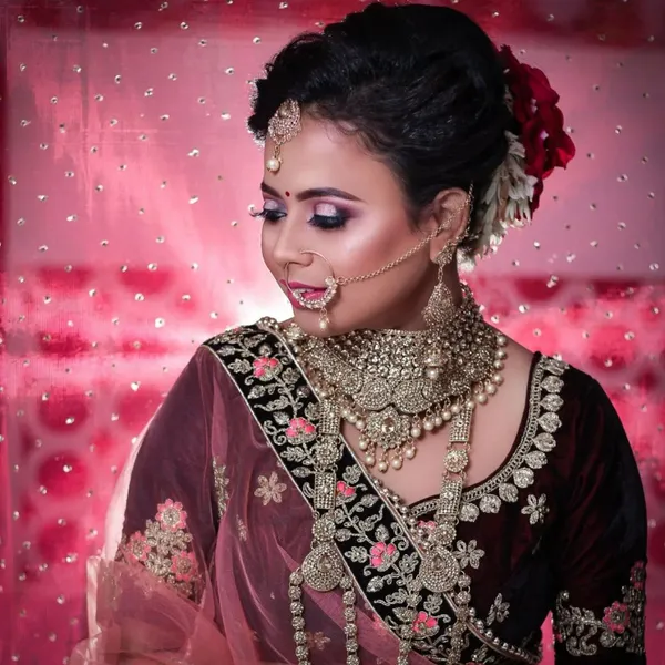 Smiling bride in maroon bridal wear