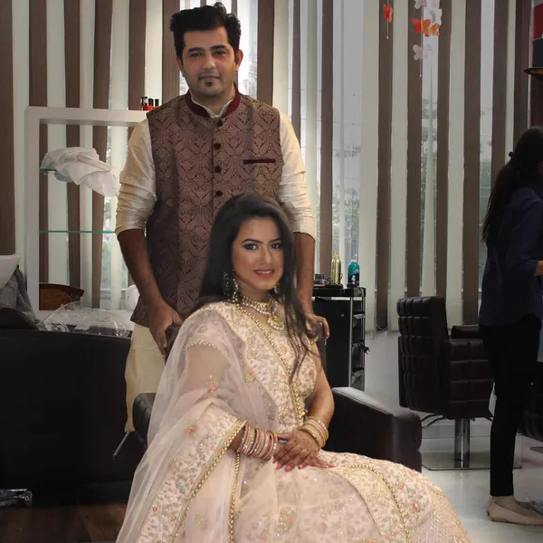 Engagement portrait of a couple, bride in cream with soft glam makeup