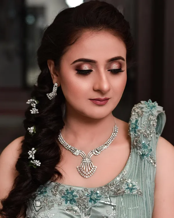 Engagement makeup in soft pastel tones with a mint lehenga and diamond set