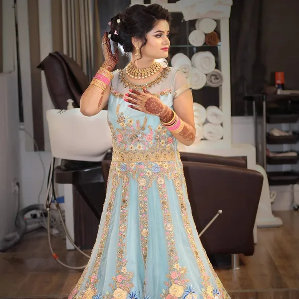 Engagement makeup with a powder blue lehenga and a light, natural base