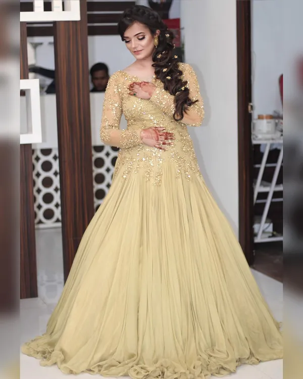 Reception gown in champagne gold with soft evening makeup