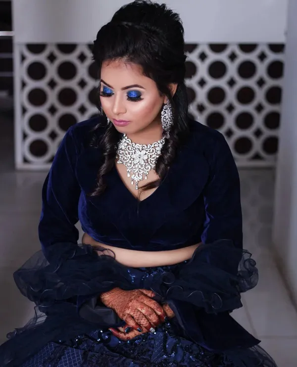 Party makeup with a navy blue lehenga and a defined eye